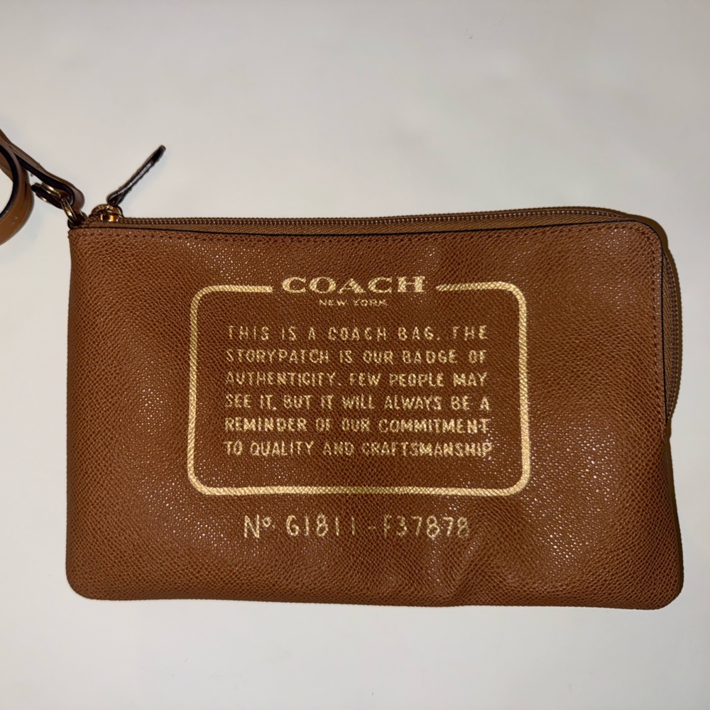 Coach Tan Wristlet with Gold Lettering storypatch